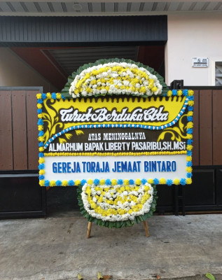 Papan Bunga Duka di Larangan Luwok
